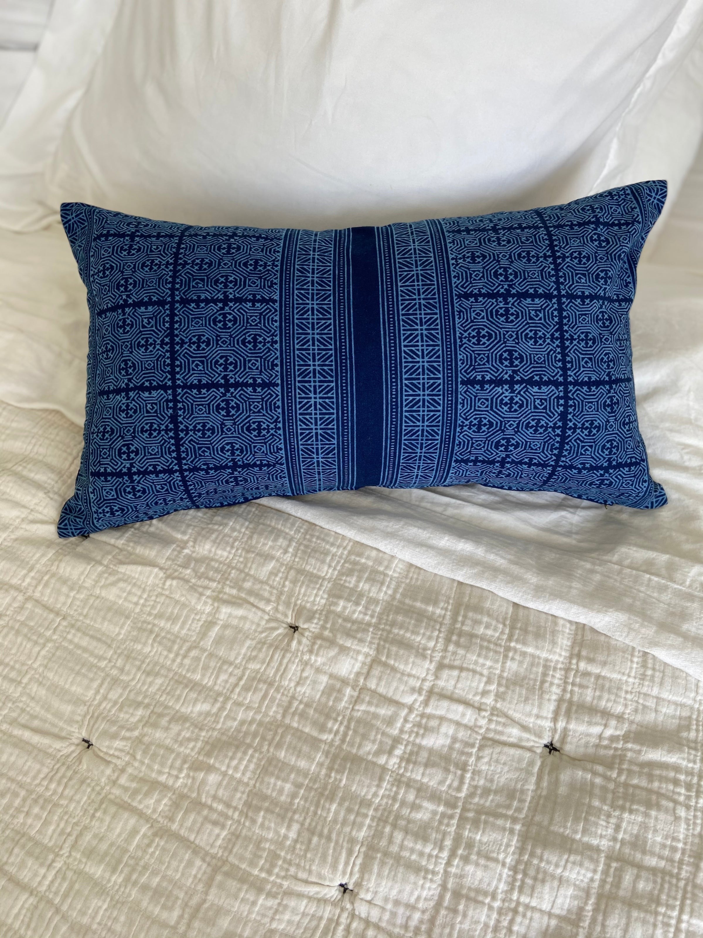 Indigo & Juniper lumbar and square pillow covers used outside.