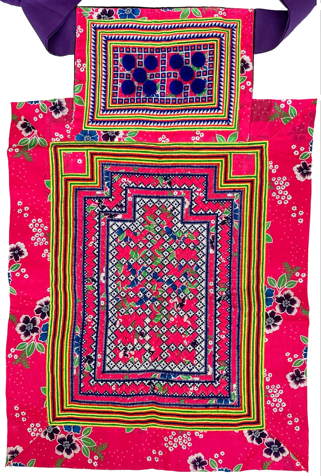 A pink hmong baby carrier with an ornate floral pattern with purple straps