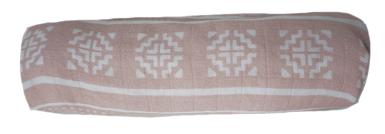 The pink batik muslin swaddle has many different use cases: such as rolled up for a head rest, blanket for when it gets cold, or a towel in those wet situations.